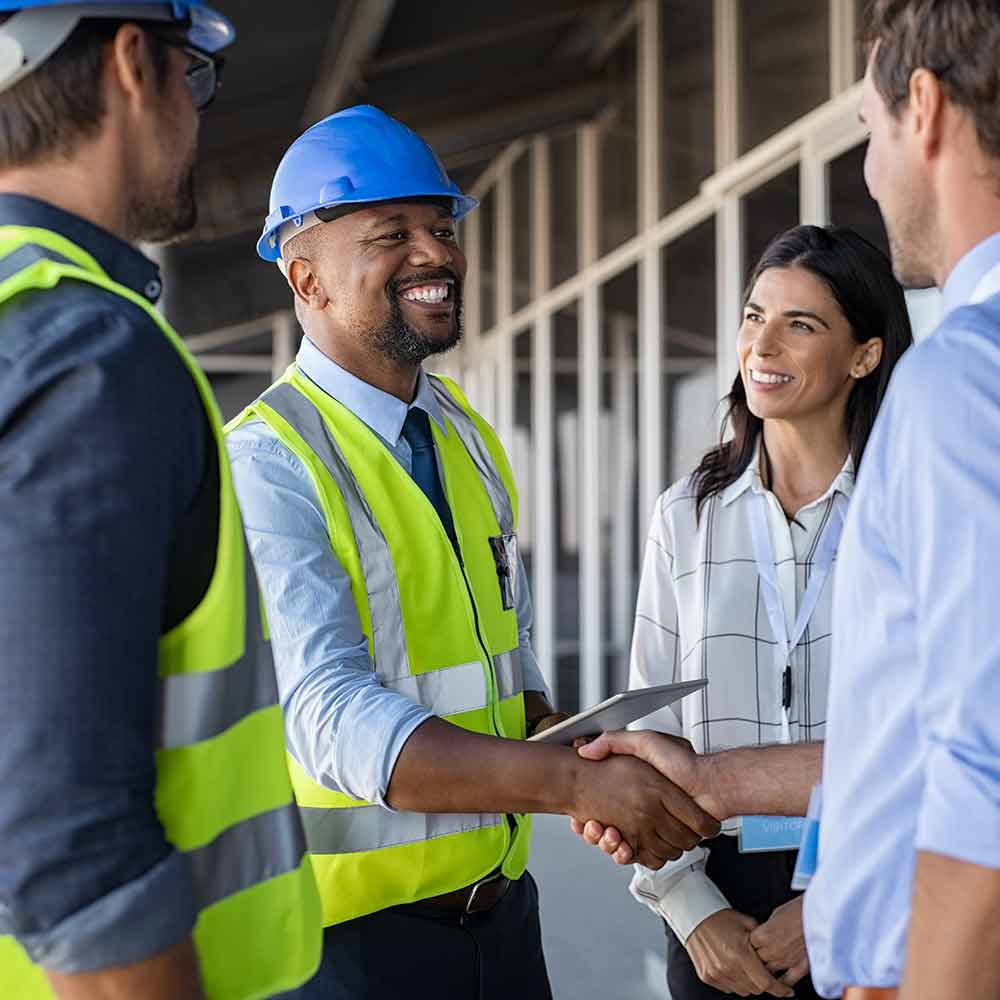 Engineer shaking hands with a client
